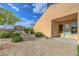 Desert-landscaped backyard featuring a patio, shrubs and trees at 2764 Leys Burnett Ave, Henderson, NV 89044