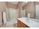 Bathroom features a shower-tub combo, sink, and handrails for accessibility at 2764 Leys Burnett Ave, Henderson, NV 89044