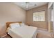 Cozy bedroom features a ceiling fan, window, and sliding-door closet at 2764 Leys Burnett Ave, Henderson, NV 89044