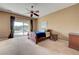 Bedroom with a ceiling fan and sliding glass door to the backyard at 2764 Leys Burnett Ave, Henderson, NV 89044