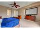 Spacious bedroom with a large entertainment center and comfortable furnishings at 2764 Leys Burnett Ave, Henderson, NV 89044