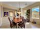 Bright dining room featuring tile floors, wooden table, and windows offering natural light at 2764 Leys Burnett Ave, Henderson, NV 89044