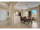 Inviting dining space features tile floors, natural light, and a seamless transition to adjacent rooms at 2764 Leys Burnett Ave, Henderson, NV 89044