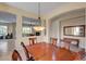 A dining room view into the living room showcases an open layout with a fireplace at 2764 Leys Burnett Ave, Henderson, NV 89044