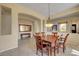 Open dining room showcasing a wooden table, console table with mirror, and neutral color palette at 2764 Leys Burnett Ave, Henderson, NV 89044