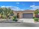Inviting single-story home with a tiled roof, landscaped front yard, and a spacious two-car garage at 2764 Leys Burnett Ave, Henderson, NV 89044