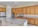 Bright kitchen with an island, stainless steel appliances, and granite countertops at 2764 Leys Burnett Ave, Henderson, NV 89044