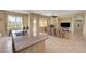 Open kitchen and living room features an island, granite counters, and stainless steel sink at 2764 Leys Burnett Ave, Henderson, NV 89044