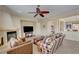 Spacious living room with a fireplace and views into the dining area at 2764 Leys Burnett Ave, Henderson, NV 89044