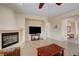 Bright living room featuring a fireplace and tile floors with an open floor plan at 2764 Leys Burnett Ave, Henderson, NV 89044