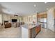 Spacious living room showcasing a kitchen with stainless steel appliances at 2764 Leys Burnett Ave, Henderson, NV 89044