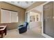 Office with a blue recliner, desk, and double doors leading to another room at 2764 Leys Burnett Ave, Henderson, NV 89044