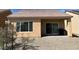 The backyard features a covered patio, ideal for outdoor entertaining and relaxation with low-maintenance landscaping at 3029 Frigate Way, North Las Vegas, NV 89084