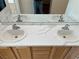 Bathroom with a double sink vanity and modern faucets at 3029 Frigate Way, North Las Vegas, NV 89084