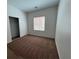 Comfortable bedroom with carpet, window, and a closet, perfect for relaxation at 3029 Frigate Way, North Las Vegas, NV 89084