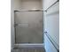 Shower with sliding glass doors, tile floor, and towel rack at 3029 Frigate Way, North Las Vegas, NV 89084