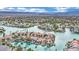 Waterfront community aerial view showcasing luxurious homes along the water with boat docks and lush landscaping at 3080 Yankee Clipper Dr, Las Vegas, NV 89117