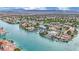 Waterfront community aerial view highlighting luxurious residences along the water, complemented by lush landscaping at 3080 Yankee Clipper Dr, Las Vegas, NV 89117