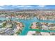 Panoramic view of waterfront homes on winding canals in a well-planned community with stunning mountain scenery at 3080 Yankee Clipper Dr, Las Vegas, NV 89117