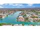 Gorgeous aerial view of waterfront homes and canals in a Primary-planned community and mountains on the horizon at 3080 Yankee Clipper Dr, Las Vegas, NV 89117