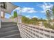 Balcony view from staircase featuring privacy fence and skyline at 3080 Yankee Clipper Dr, Las Vegas, NV 89117
