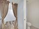The bathroom has a unique stall with a toilet, white walls, and a peek at the shower stall at 3080 Yankee Clipper Dr, Las Vegas, NV 89117