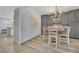 A cozy breakfast nook with a chandelier and gray cabinetry at 3080 Yankee Clipper Dr, Las Vegas, NV 89117