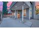 Two-story exterior with a covered entry, gray siding, and well-maintained landscaping at 3080 Yankee Clipper Dr, Las Vegas, NV 89117
