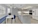 Bright, modern kitchen with gray cabinetry, stainless steel appliances, an island, and a breakfast nook at 3080 Yankee Clipper Dr, Las Vegas, NV 89117