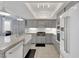 Well-lit kitchen with stainless steel appliances, white backsplash, and gray cabinetry at 3080 Yankee Clipper Dr, Las Vegas, NV 89117