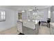 A bright kitchen features a large island with seating, perfect for entertaining at 3080 Yankee Clipper Dr, Las Vegas, NV 89117