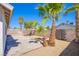 Backyard view of a patio, palm trees and desert landscaping at 3118 Floral Vista Ave, Henderson, NV 89014