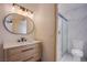 Modern bathroom featuring a vanity with a mirror and a glass-enclosed shower at 3118 Floral Vista Ave, Henderson, NV 89014