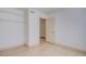 Neutral bedroom featuring closet and entry doors, plus bare shelving at 3118 Floral Vista Ave, Henderson, NV 89014