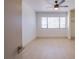 Bright bedroom with wood flooring, large window, and a ceiling fan at 3118 Floral Vista Ave, Henderson, NV 89014