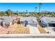 Aerial front view of single-story home with a two-car garage and desert landscaping at 3118 Floral Vista Ave, Henderson, NV 89014