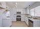 Stylish kitchen with stainless steel appliances, modern cabinets, and marble countertops at 3118 Floral Vista Ave, Henderson, NV 89014