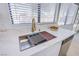 Kitchen sink featuring modern fixtures and marble countertops at 3118 Floral Vista Ave, Henderson, NV 89014