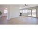 Open living room with French doors and new wood flooring at 3118 Floral Vista Ave, Henderson, NV 89014