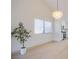 Well-lit living room with a chandelier and open layout to kitchen at 3118 Floral Vista Ave, Henderson, NV 89014
