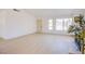 Bright open-concept living room boasts sleek flooring, large windows, and fireplace at 3118 Floral Vista Ave, Henderson, NV 89014