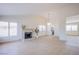 Bright living room boasting a fireplace and contemporary lighting fixture at 3118 Floral Vista Ave, Henderson, NV 89014