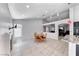 Dining area featuring a fireplace, natural light, and tiled floor at 3413 Freestone Ln, North Las Vegas, NV 89032