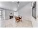 Bright dining area with fireplace and tile flooring; adjacent to kitchen at 3413 Freestone Ln, North Las Vegas, NV 89032