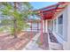 Exterior view highlighting a covered patio area with views of the well-maintained property at 3413 Freestone Ln, North Las Vegas, NV 89032