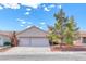 Charming single-story home with a two-car garage, well-maintained landscaping, and beautiful curb appeal at 3413 Freestone Ln, North Las Vegas, NV 89032