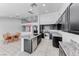 Modern kitchen featuring a large island, stainless steel appliances, and open layout at 3413 Freestone Ln, North Las Vegas, NV 89032