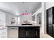 Kitchen island with stainless steel dishwasher and granite countertops at 3413 Freestone Ln, North Las Vegas, NV 89032
