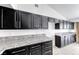 Kitchen cabinets featuring granite countertops, stainless steel appliances, and modern hardware at 3413 Freestone Ln, North Las Vegas, NV 89032