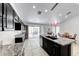 Bright kitchen with granite countertops, stainless steel appliances, and access to outdoor patio at 3413 Freestone Ln, North Las Vegas, NV 89032